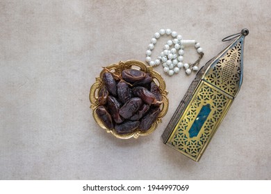 Top View Of Lantern, Dates Fruit And Rosary Beads. Ramadan And Eid Photo Concept.