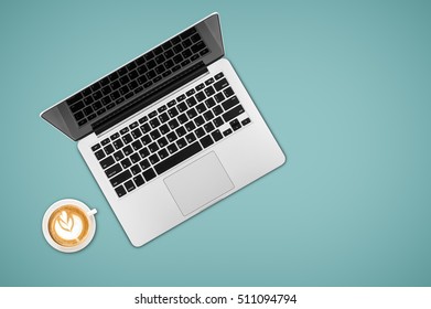 Top View Laptop Computer With Cup Of Coffee On Office Desk Table.Business Template Mock Up For Adding Your Text.