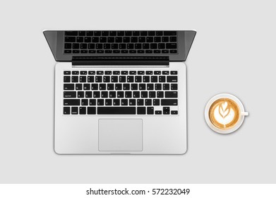 Top view laptop computer with cup of coffee on office desk table.Business template mock up for adding your text.