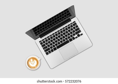 Top view laptop computer with cup of coffee on office desk table.Business template mock up for adding your text.