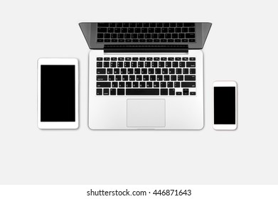Top view laptop computer with mobile phone and tablet on office desk.Business template mock up for adding your text