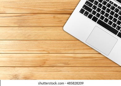 Top view laptop computer with mobile phone and tablet on office desk.Business template mock up for adding your text