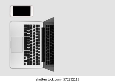 Top view laptop computer with mobile phone on office desk table.Business template mock up for adding your text.
