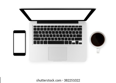 Top View Of Laptop, Smartphone And A Cup Coffee On Isolated White Background. 