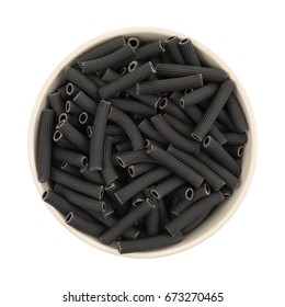 Top View Of A Large Bowl Filled With Black Bean Pasta Isolated On A White Background.