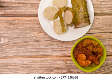 Top View Of LEMANG And Chicken Rendang Served During Ramadan And Eid Mubarak. Glutinous Rice Is Wrapped With Banana Leaf Encased In Bamboo Culm And Cooked In Open Fire.