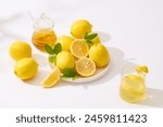 Top view at lemon photography with some fresh lemon and other natural ingredients flat lay on white background. Photo for advertising product of lemon