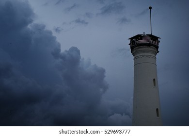 Top view of light house with a dramatic cloud. A copy space.