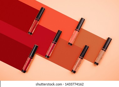 Top view of lipsticks mockup.Workspace with cosmetics colourful tone. Colorful composition with red lipsticks gross pattern concept.