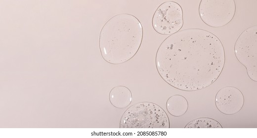 Top view of liquid cosmetics gel with bubbly structure on pastel background.Good as cosmetic mockup,large banner. - Shutterstock ID 2085085780