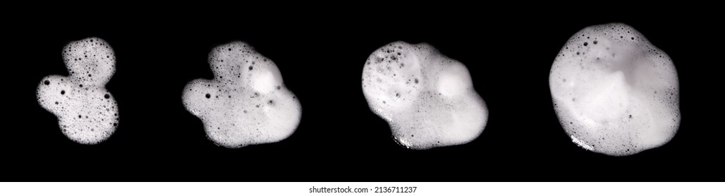 Top view, liquid white foam from soap or shampoo or shower gel. Abstract bubbles. isolated on a black background 