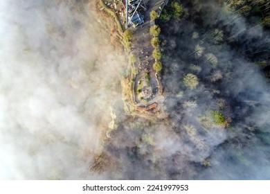 Top view from local mountain Uetliberg on a foggy winter day with lookout point and lookout tower fog at Christmas Day. Photo taken December 25th, 2022, Uetliberg, Canton Zürich, Switzerland. - Powered by Shutterstock