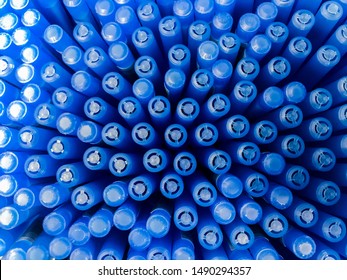 Top view of lots of blue ballpoint pen caps as abstract background sold in stationery store. Back to school concept