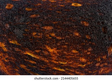 top view macro closeup of black burnt toast bread slice texture background