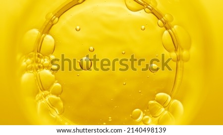 Top view macro shot of violed liquid in beaker with bubbles on yellow background | Abstract face care cosmetics formulation concept