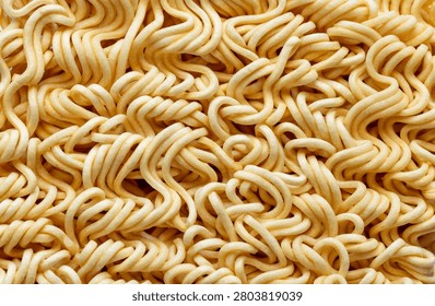 Top View Macro Texture of Uncooked Instant Noodle Block,A detailed close-up shot focusing on the intricate wavy texture of an uncooked instant noodle block, highlighting the pattern of dried wheat dough strands.