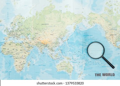 Top View Of Magnifying Glass On World Map 