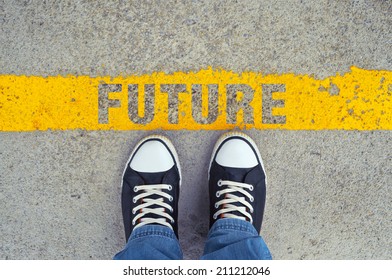 Top View Of Male Sneakers On The Asphalt Road With Yellow Line And Title Future, Step Into The Future.