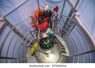 Top View Male Worker Climb Up The Stairs Into The Tank Stainless Chemical Area Confined Space Safety Blower Fresh Air