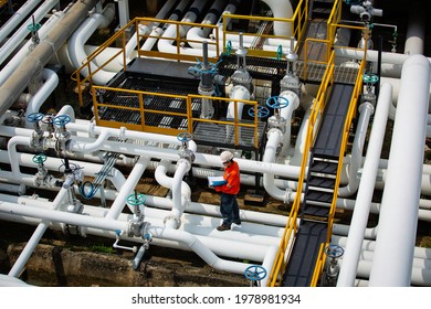 Top view male worker inspection at valve of visual check record pipeline oil and gas industry