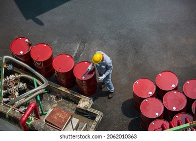 Top View Male Worker Inspection Record Drum Oil Stock Barrels Red Vertical Or Chemical For In The Industry.