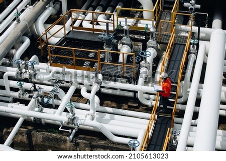 Top view male worker inspection at valve of visual check record pipeline oil and gas industry