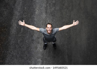 Top View Of Man With Arms Wide Open