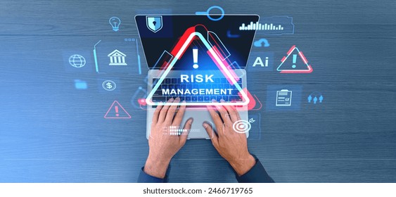 Top view man hands typing on laptop. Virtual screen with risk management symbol and glowing diverse banking or marketing icons. Concept of business safety and financial analysis - Powered by Shutterstock