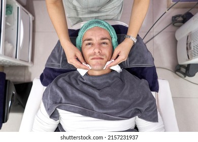 Top View Of A Man Lying Down On A Stretcher Ready For A Facial Beauty Treatment