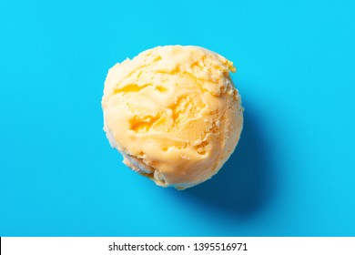 Top View Mango Flavor Ice Cream Ball On Blue Background