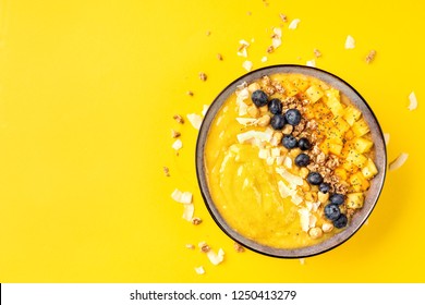 Top View Of Mango Smoothie Bowl With Fruits