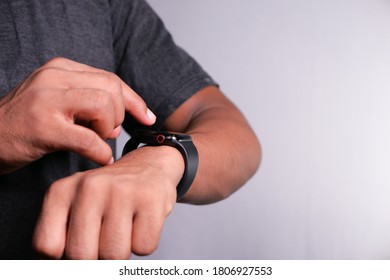 top view of man's hand using smart watch.