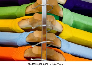 Top View Many Colorful Shirts Hanging On A Rack