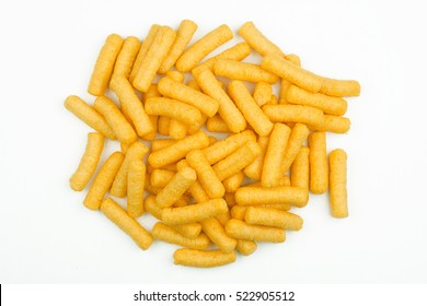 top view of many corn puff snacks isolated on white background
