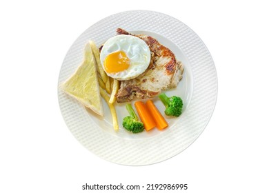 Top View Of Meat Steak With French Fries, Fried Eggs, Toast On White Plate, Focus Selective