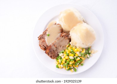 A Top View Of Meatloaf With Mashed Potatoes And Gravy