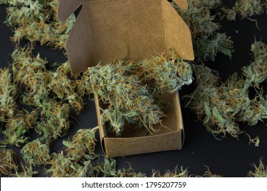 Top View Of Medical Cannabis In Box With Marijuana On Background. Weed Delivery Business