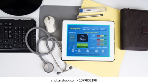 Top View Of Medical Record System Show Patient Information On Digital Tablet On Working Desk.