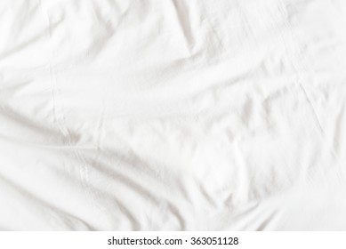 Top view of a messy bedding sheet after night sleep.