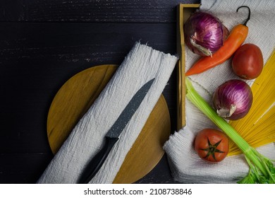 A Top View Of A Messy Kitchen Table With A Knife And Ingredients