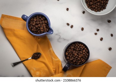 A Top View Of A Messy Kitchen Table With Bowls Of Coffee Beans