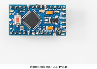 A top view of a microcontroller circuit board isolated on a white background