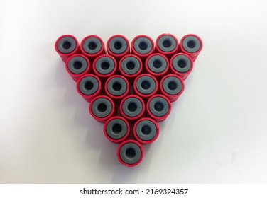 Top View Of Mini Blood Tube Arranged In It’s Container, Test Tube Cap, Logo Concept.