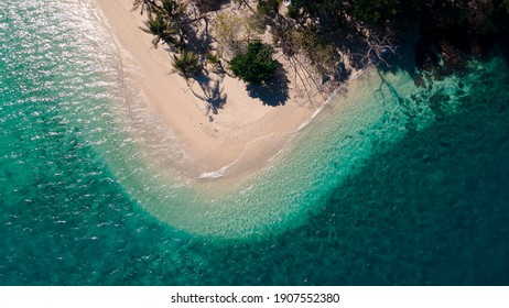 top view of mixed clear green blue sea waving on curve beach island, Rayang island beach, travel destination in Trat, Thailand
