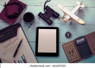 top view mock up tablet similar style on color wood 
, office tool book note and binocular,Vintage tone. - Shutterstock ID 661437223