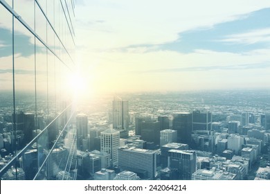 Top View Of Modern City In Lights Of Sunset