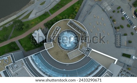 Top view of modern round building with dome. Stock footage. Beautiful architecture of business center with round structure and dome. Rings of building with beautiful facade