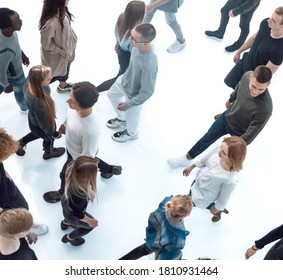 Top View . Modern Young People Walking In Opposite Directions