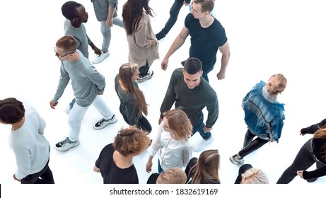 Top View . Modern Young People Walking In Opposite Directions