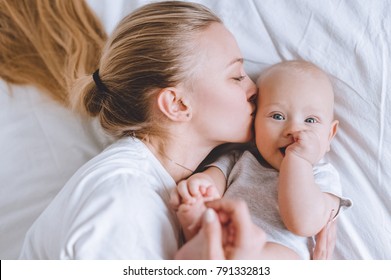 mother kiss baby